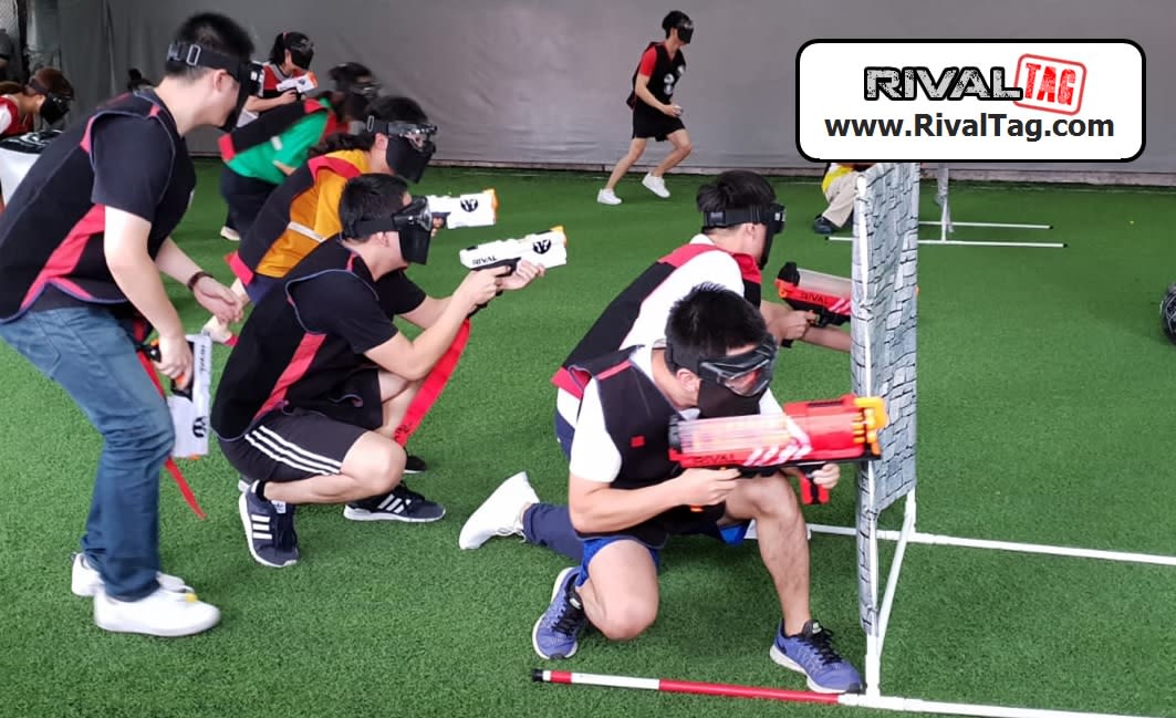 Take cover behind the "walls" to avoid getting shot! | RIVAL TAG Singapore Team Building
